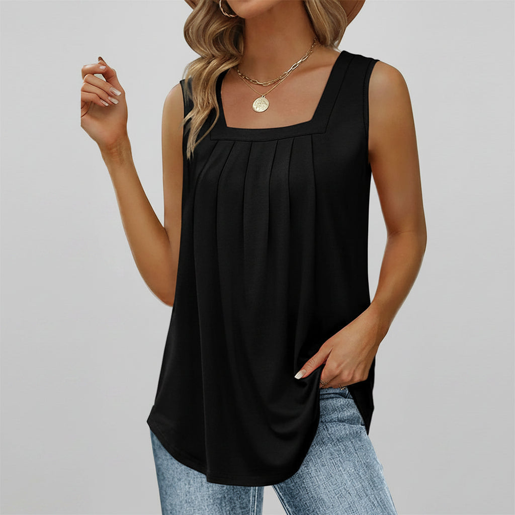 Black sleeveless top worn by a model on a white background