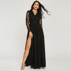 Woman wearing a black lace long-sleeve dress with a slit on a white background