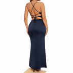 Navy blue dress with criss-cross back design on a beige background