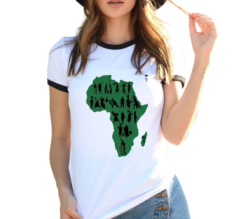 Person wearing a white t-shirt with a green map of Africa design, standing against a colorful wall.