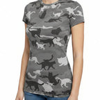 Person wearing a camouflage-patterned shirt with animal silhouettes outdoors.