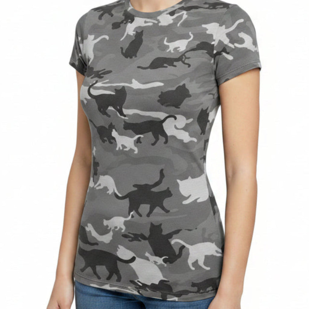 Person wearing a camouflage-patterned shirt with animal silhouettes outdoors.