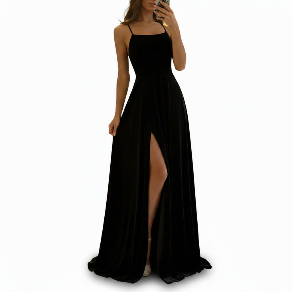 Person wearing a black dress with a high slit in a store setting
