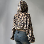 Leopard print hoodie worn by a person on a gray background