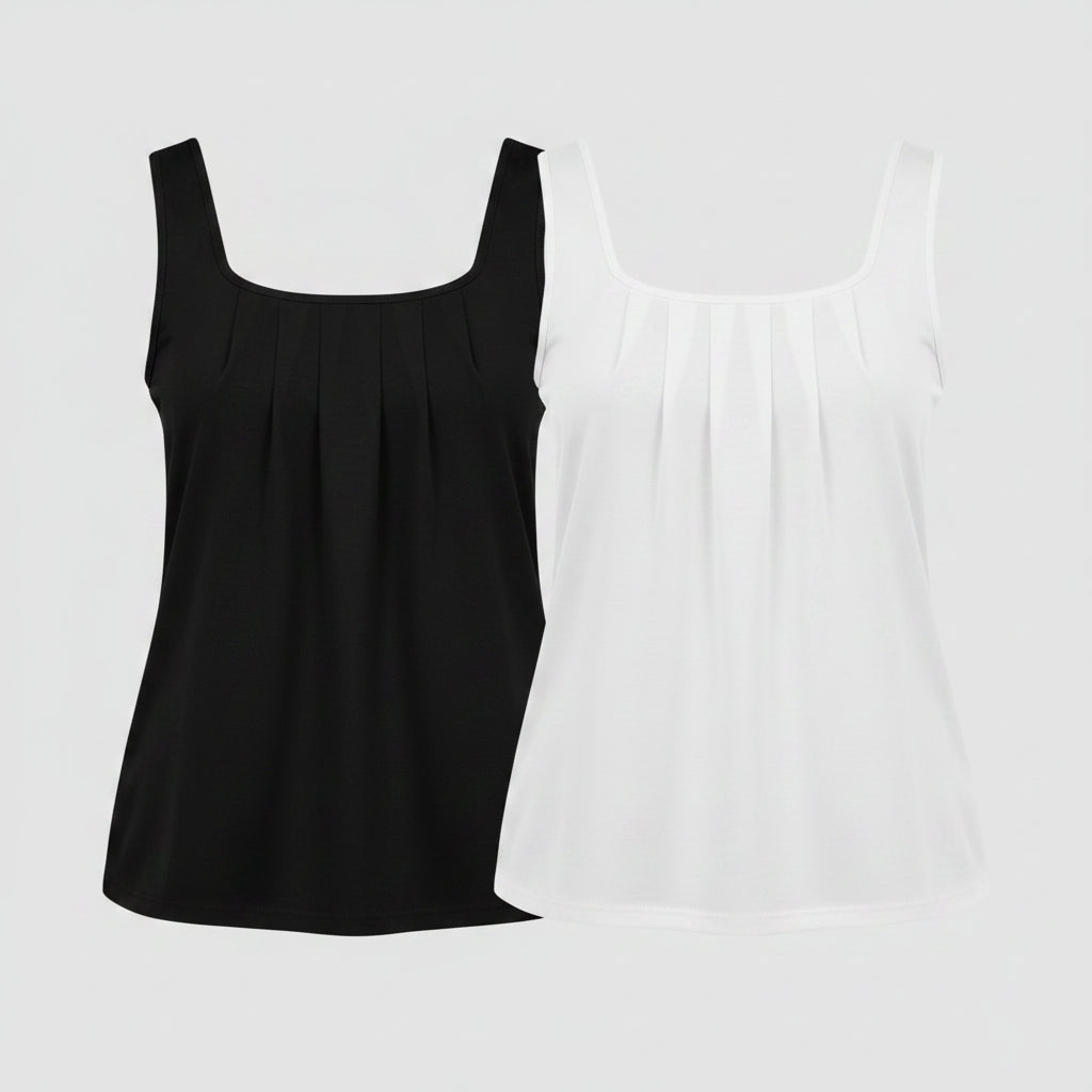 Two women wearing black and white sleeveless tops with denim skirts.