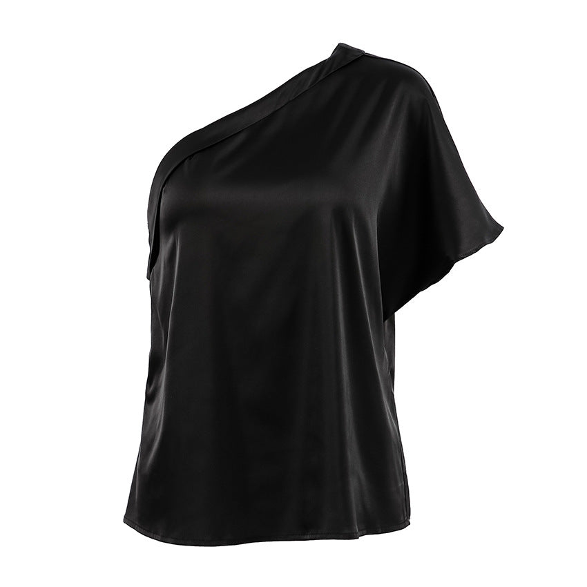 Black one-shoulder top on a white background
