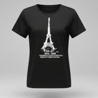 Person wearing a black t-shirt with Eiffel Tower design, sitting on the floor.