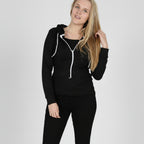 Woman wearing a black hoodie with white zipper on a white background
