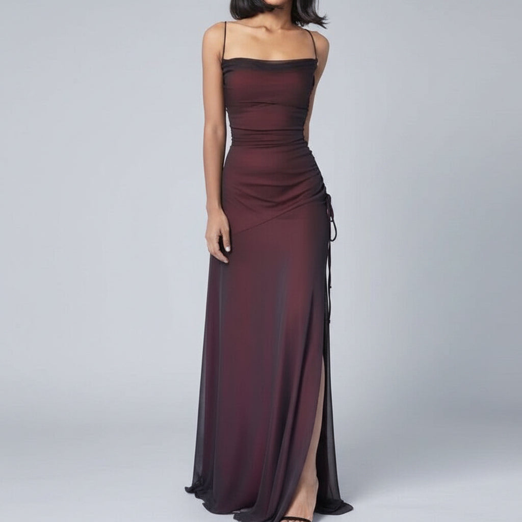 Burgundy evening gown with a slit on a white background