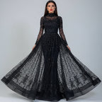 Black sheer evening gown with long sleeves and a flowing skirt on a neutral background